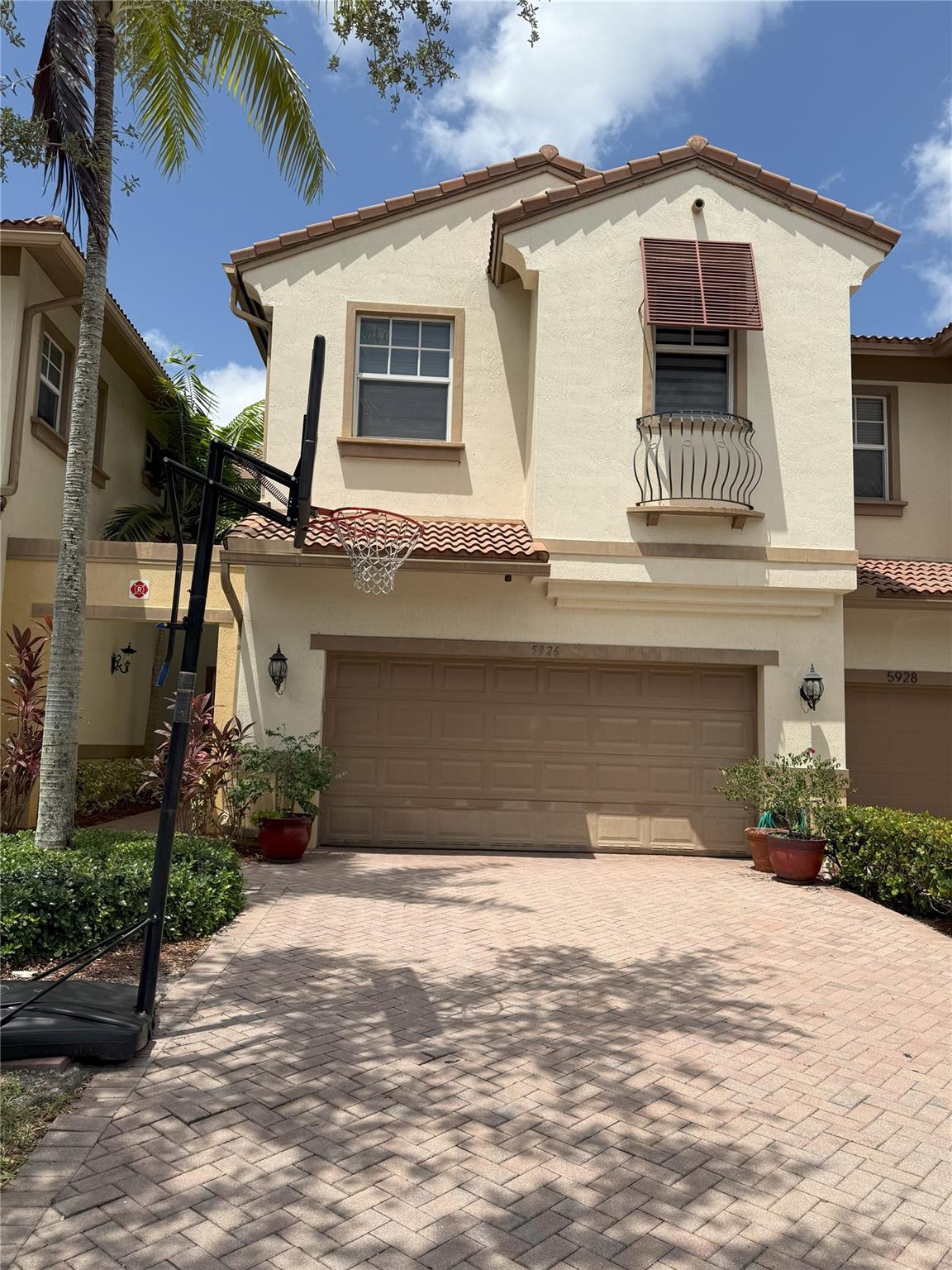 RARE opportunity to own this stunning and well maintained 2,450 SQFT home with 3 bedrooms and a BONUS ROOM attached to the master bedroom. 2.5 bathrooms, A nice LOFT/SEATING AREA upstairs, and a two-car garage The home is located in the GATED community of Heron Bay. This home showcases stunning vaulted ceilings and an open layout, enhancing its overall appeal. The home features: Hardwood floors on the stairs and 2nd floor hallway , Granite countertop, Hurricane windows and doors New window blinds, Upgraded light fixtures.