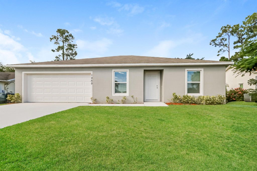 Photo of 1050 SW Abingdon Avenue, Port Saint Lucie, FL 34953 (MLS # R10984025)
