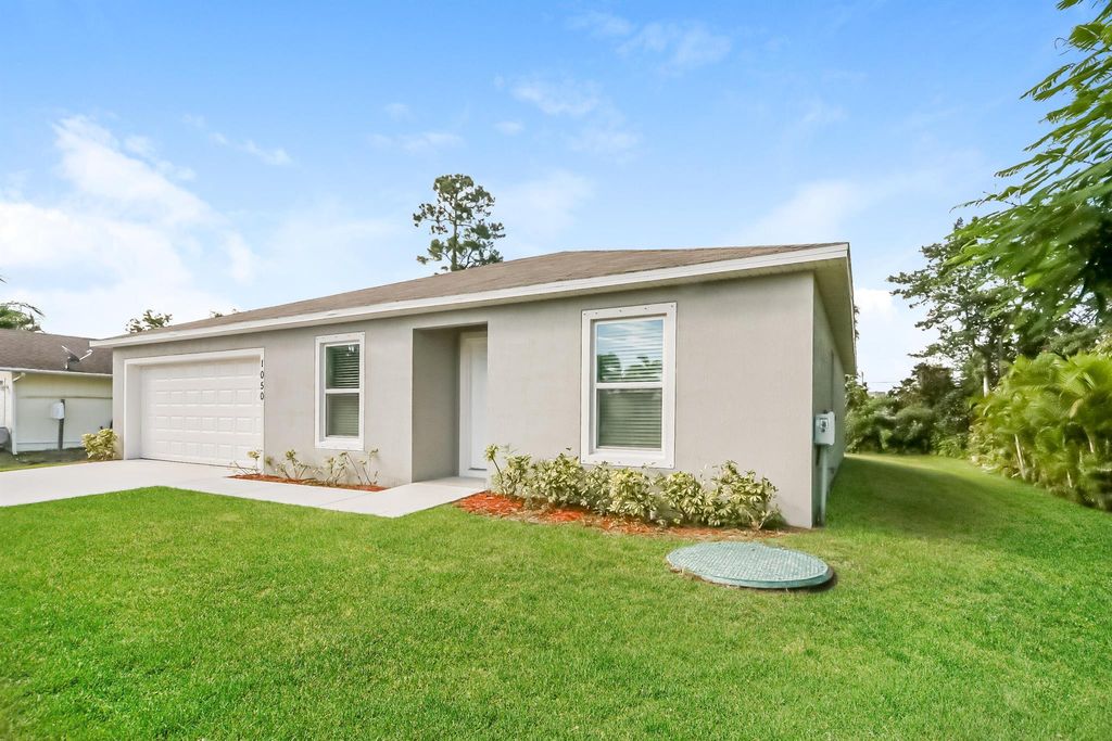 Photo of 1050 SW Abingdon Avenue, Port Saint Lucie, FL 34953 (MLS # R10984025)