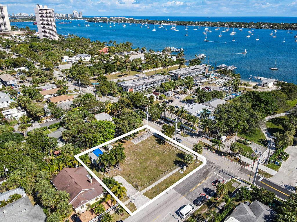 Flagler Drive buildable lot. The lot can be divided with one lot at 51 x 125, and 50 x 125 with Flagler Drive addresses. The west lot has a beautifully updated 1 bedroom cottage sitting at the back of the lot allowing for 2 new construction homes facing Flagler Dr. across from the Sailing Club. Walking distance to the new Marina project at Rybovich Marina. A subdivision application needs to be processed through the city in order to divide the lots. This property is in the middle of many city approved re-development projects scheduled to begin this year. A great opportunity. The existing cottage has new A/C, hurricane shutters. The property is in OZ zoning. Opportunity Zones are a chance to provide economic incentives to increase equity in your community.