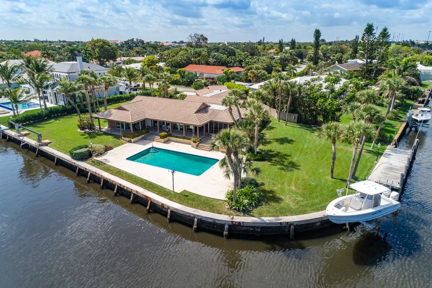 First time offered in 42 years, this is a builder's own home with 274 ft on the Intracoastal & side canal.  A rare NE point lot in Place Au Soleil of only 6 total points in the development this is the 2nd largest. Home is 3/3 with great bones, a 3 way split floor plan & vaulted beamed ceilings in the living/dining room & pecky cypress kitchen centers it all overlooking the waterway with spectacular views of the boats cruising by & the Gulf Stream Golf course across.  This opportunity is one of a kind for the area & this ''best kept secret'' of a neighborhood is just outside Downtown Delray's hustle & bustle. It is quiet & private with only 93 homes.  Patrolled by Gulf Stream police the security & value is unparalleled to any other waterfront offer in the area.