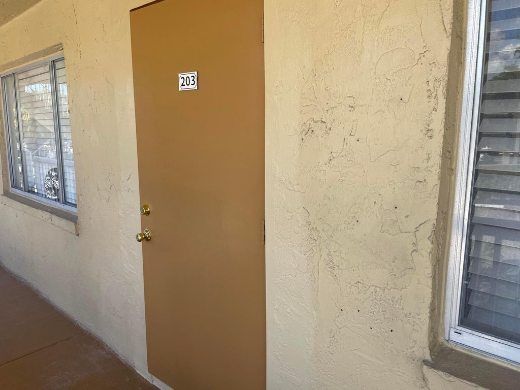 Photo of 555 Purdy Lane #203, Palm Springs, FL 33461 (MLS # R11116454)