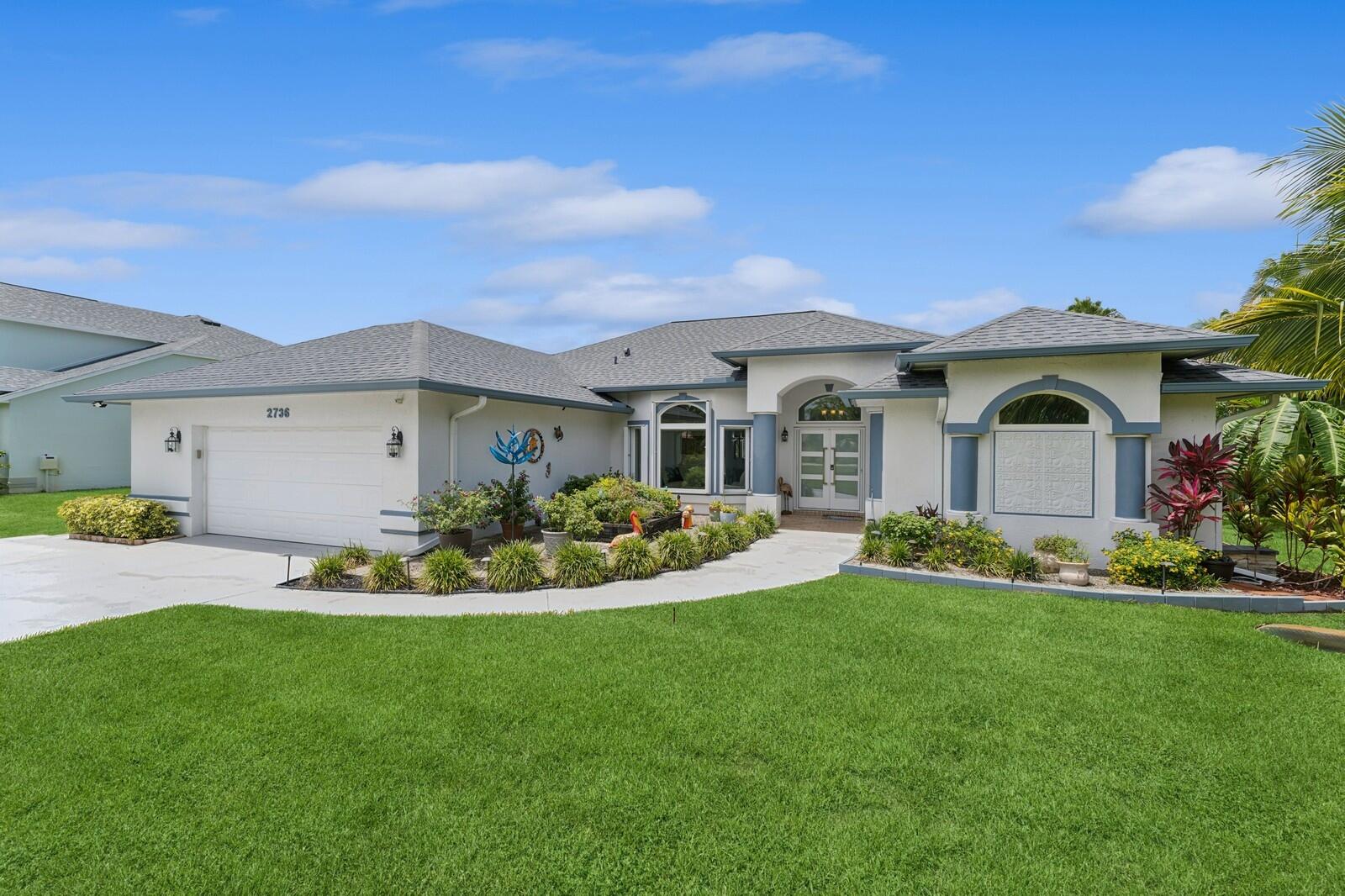 Beautiful move-in ready Pool home on the C24 canal with 2 private docks on 2/3 acre lot with whole house generator (2023). Automated thermostat, window treatments, sprinklers & light switches, New Impact windows & door (2024). 2 A/C units (2020), induction/convection range, corian counter tops, beverage refrigerator, fiber optic TV/Internet, oversized garage, Cabana shower. Hookup for Electric vehicle in garage & 30 AMP for RV/Boat outside. 12,000 lb boat lift, boat roof & a floating dock & so much more! C24 canal park boat ramp is right down the street. Waterway restaurants coming soon to the Pioneer Park by the Botanical Garden. Easy access to Turnpike & I-95. This one is a MUST SEE!!!