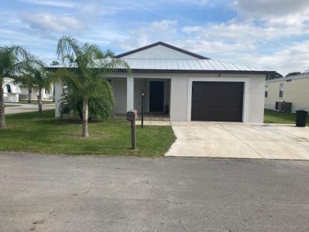 Photo of 2 SE Los Gatos Lane, Port Saint Lucie, FL 34952 (MLS # R10768575)