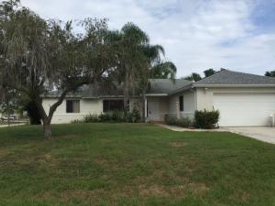 Charming 3 bedroom, 2 bathroom, 2 car garage home with a great location on a Corner Lot! Indoor laundry room with washer and dryer hookup, tiled entry way, separate living room, family room, and dining room. Family room, kitchen, and dining room are all tile. Carpet in bedrooms and living room only. Large master suite with soaking tub in the master bath and granite countertops for the master bath sink. Split bedroom floorplan with a pocket door, giving guests privacy for the 2 additional bedrooms and the 2nd bathroom. Large screened and covered porch with tile floors - great for entertaining! Door leading from the porch area right outside of the second bathroom, very convenient. The outside condensing unit for the A/C is new to 2011. Special allergen light in the filter.