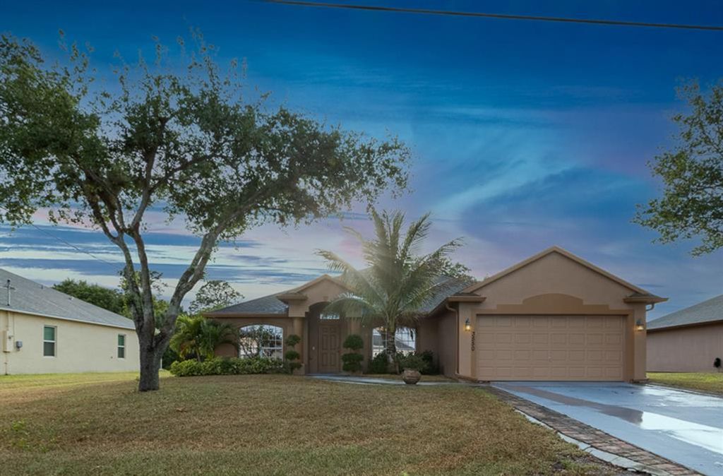 Photo of 3550 SW Rosardo Street, Port Saint Lucie, FL 34953 (MLS # R10704430)