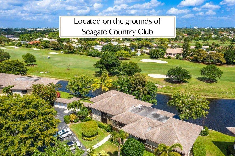 Welcome to The Hamlet at The Seagate Country Club--one of Delray Beach's most desirable guard-gated communities, just minutes from downtown and the beach. This beautifully updated first-floor corner condo offers serene lake and golf course views from the spacious patio. Features include impact windows, a brand-new AC, new refrigerator, and phantom screen door. Surrounded by mature trees and lush landscaping, the community is perfect for walking, biking, or simply enjoying the scenery. Heated pool just steps away. Enjoy country club living in the heart of Delray with NO mandatory membership dues.