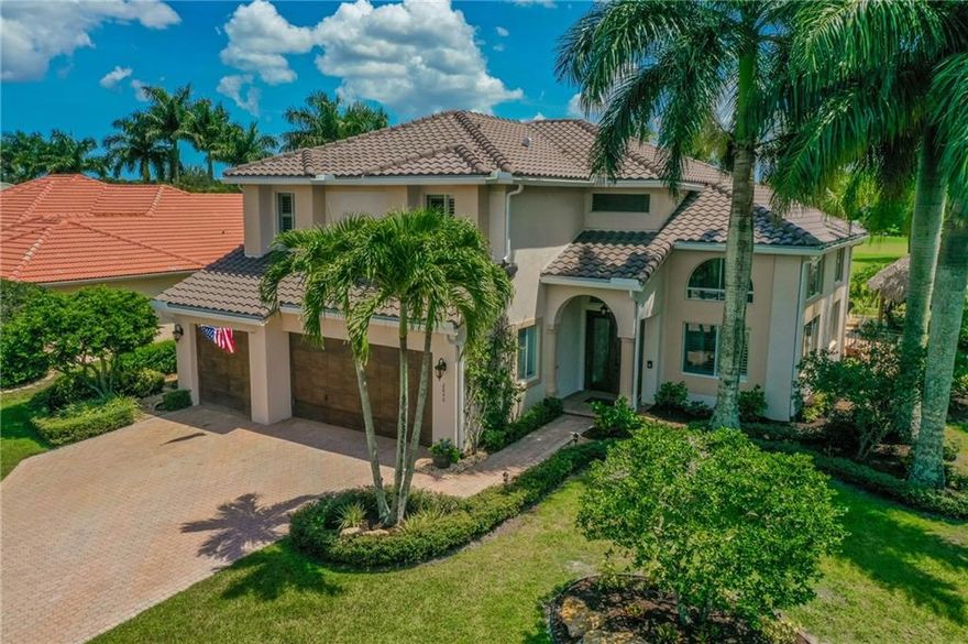 Tropical retreat like no other in Hammock Creek on the golf course & next to preserve for maximum privacy. True 5 BR/3BA/3-car garage, pool with spa, koi pond w/waterfall, Tiki Hut constructed by Seminole Indians - large pool deck w/imported travertine. New roof in 2018; pool w/salt chlorination system; LED lighting upgrades, cherry kitchen w/stainless appliances, granite, Custom door hardware, custom lighting, terrace, tropical landscaping & uplighting.