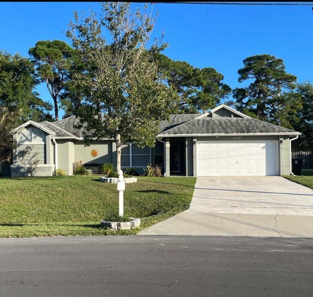 Photo of 1697 SW Clover Street, Port Saint Lucie, FL 34953 (MLS # R10940200)