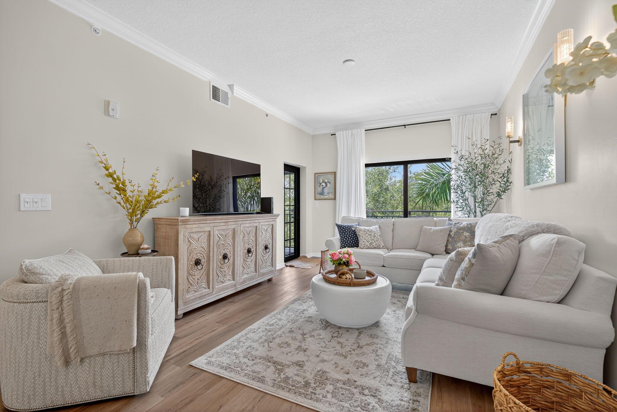 Luxury living in the heart of Palm Beach Gardens! This top-floor, 2BD/2BA condo features soaring ceilings, high-end finishes, and a private balcony with tranquil views. Located in the upscale Residences at Midtown, enjoy a secure gated entry, private lobby, elevator, resort-style pool, elegant clubhouse, fitness center, and business lounge. Walk to fine dining, boutique shopping, and entertainment. Minutes to beaches, golf, and all that PGA Blvd offers.