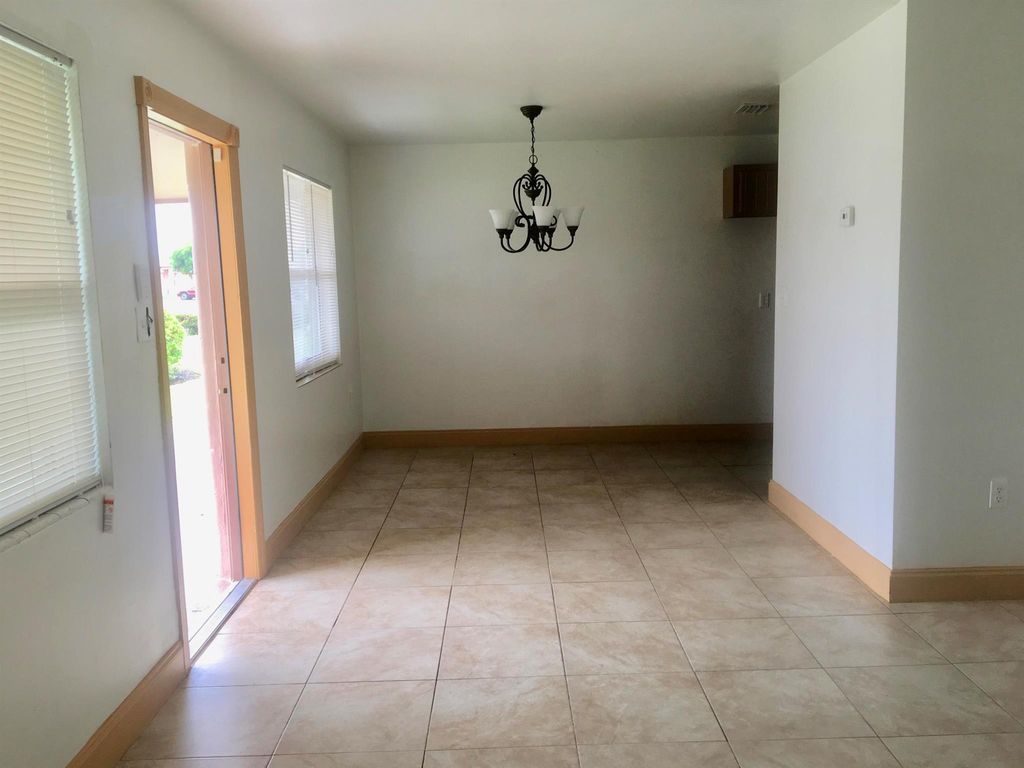 Photo of 573 SW 14th Street, Belle Glade, FL 33430 (MLS # R11001430)