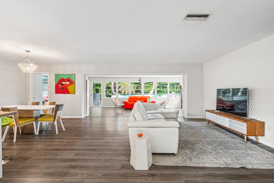 NO HOA!!! 3BR/2BA  pool home in the sought-after waterfront community of Hypoluxo Shores, just steps from the Intracoastal. This single-story home features a split floor plan, open living spaces, and a Florida room overlooking a private tropical backyard. Recent upgrades include impact windows and doors (2022), new roof (2023), and new HVAC (2024). The kitchen offers granite countertops, stainless steel appliances, and ample storage, with laminate flooring throughout the main living areas. Enjoy a fenced backyard with a heated pool, spa, and lush landscaping, perfect for relaxing or entertaining. Quiet dead-end street location close to beaches, shopping, dining, and major highways. Move-in ready with all major updates completed. Great investment unit to add to your portfolio! even Airbnb for Short Term Stays!