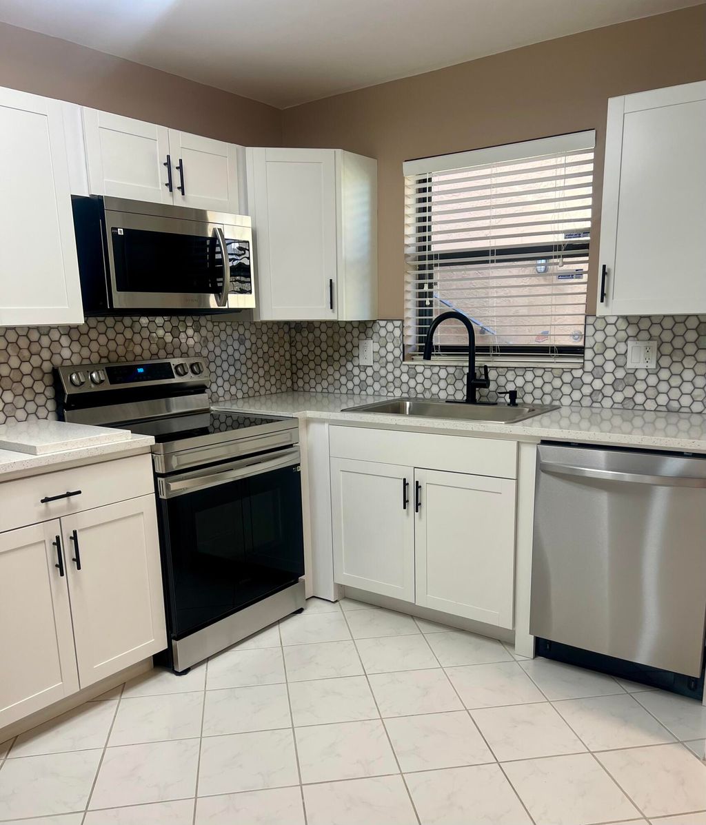 Photo of 1961 W Woolbright Road #D101, Boynton Beach, FL 33426 (MLS # R11049878)