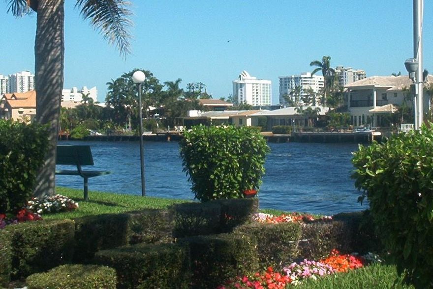 2/2 on first floor in gated community-unit will be freshly painted-open kitchen-newer tile throughout