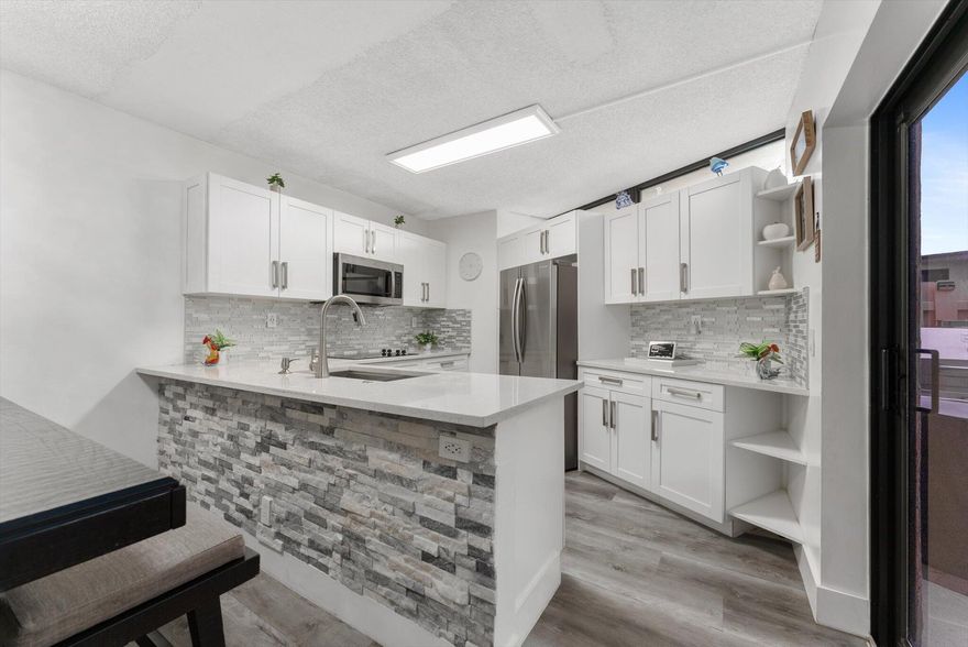 Beautiful and fully renovated townhouse featuring two spacious master bedrooms, each with its own private bathroom, plus a guest half-bathroom on the first floor. This bright and airy home offers a modern kitchen with updated cabinets and stainless steel appliances, renovated bathrooms, and impact windows and doors providing full protection and peace of mind. With abundant natural light, an open layout, and stylish finishes, this property is move-in ready. Perfect for first-time homebuyers or investors, the community allows immediate rentals! Enjoy a low HOA that covers exterior maintenance and community amenities. Close to excellent schools, restaurants, supermarkets, and just 1 and 15 minutes from the beach. This is the ideal combination of convenience, value, and modern living in