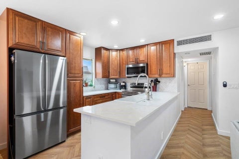 Photo of 156 Seville Ln, Delray Beach, FL 33446 (MLS # B26019449)