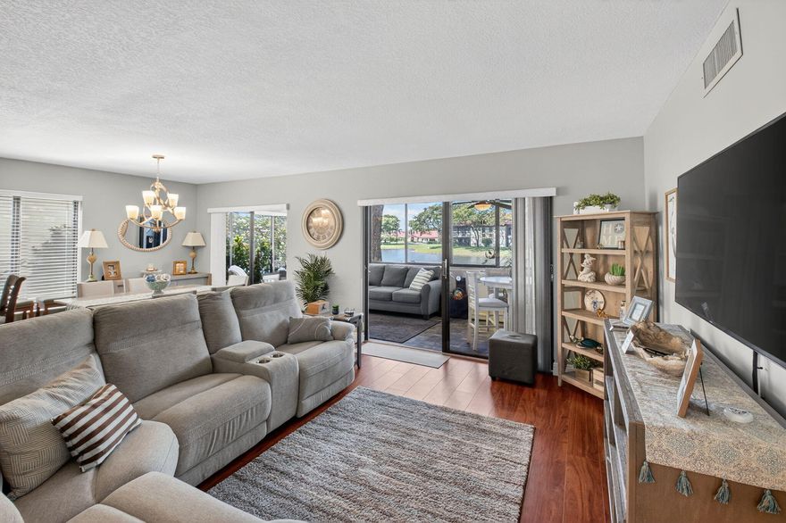 Resort-Style Living with Stunning Lake Views! Stunning 3-bedroom, 2-bath first-floor residence (configured as 2 bedrooms plus a den/optional 3rd bedroom) offering full impact windows, extra storage, and serene waterfront living in the heart of Boynton Beach.
This beautifully renovated, move-in-ready home is perfectly positioned in a picturesque lakeside setting. The chef's kitchenfeatures crisp shaker cabinetry, sparkling quartz countertops, stainless steel appliances, and a spacious layout.
The open-concept design flows effortlessly into the enclosed Florida room, where custom motorized blinds frame tranquil lake views -- the perfect place to enjoy peaceful mornings and relaxing evenings. The expansive primary suite is complete with a walk-in closet, additional wall closet, and a beautifully updated ensuite bath featuring dual vanities and elegant finishes. Two additional bedrooms (or den/flex space) provide versatility for guests, a home office, or hobbies.
Enjoy multiple outdoor spaces including the enclosed Florida room, front courtyard, and side patio -- embracing the best of South Florida's indoor-outdoor lifestyle. 
Full impact windows throughout provide energy efficiency, and storm protection.
Impeccably maintained and ideally located near shopping, dining, and major highways, this exceptional lakefront residence is more than just a home -- it's a lifestyle.

Don't miss your opportunity to own this slice of paradise.

Property Features:

*2 Bedrooms + Den/optional 3rd Bedroom - Versatile space for a home office or guest room
*Fully Renovated & Move-In Ready - Stylish, modern updates throughout
*Lakeside Location - Enjoy breathtaking water views
*Luxury Flooring - Laminate & porcelain tile throughout
*Chef's Kitchen - Shaker cabinetry, quartz countertops & stainless steel appliances
*Enclosed Florida Room - Impact sliders & custom motorized blinds for serene lake views
*Expansive Primary Suite - Walk-in closet, additional wall closet & spa-like ensuite bath
*Double Vanities in Primary Bath - Elegant finishes for a luxurious touch
*Multiple Outdoor Spaces - Florida room, front courtyard & side patio for ultimate relaxation
*Full Impact Windows - Peace of mind with storm protection
*Designer Upgrades - Modern elegance in every detail


*Community Features:

*Resort-Style Amenities
*Full Facility Clubhouse
*Auditorium
*Heated Pool & Hot Tub
*Tennis & Pickleball Courts
*Fitness Classes
*Billiards
*Ping Pong
*Bocce Ball
*Library
*Game Nights


*Social Clubs & Activities:

*Bridge Club
*Book Club
*Current Events Discussions
*Pickleball
*Tennis Club
*Knitting & Craft Club
*The "Dinner Out" Club
*Social Club & Community Events