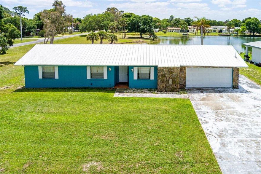 Spacious CBS lakefront home on a desirable corner lot! This 3-bedroom, 2.5-bath residence offers 1,998 sq ft of living space with a large air-conditioned Florida room that can easily serve as a 4th bedroom, office, or flex space. Enjoy peace of mind with a 2018 metal roof, A/C, and water heater, along with partial impact windows & sliding doors along the rear of the home. Features include tile & laminate flooring throughout, a covered patio, and a whole-house generator outlet added convenience. Relax and take in serene water views or enjoy canoeing, kayaking, and fishing right from your backyard. This home offers incredible potential and is ready for your personal touches. Don't miss this opportunity to make it your own!