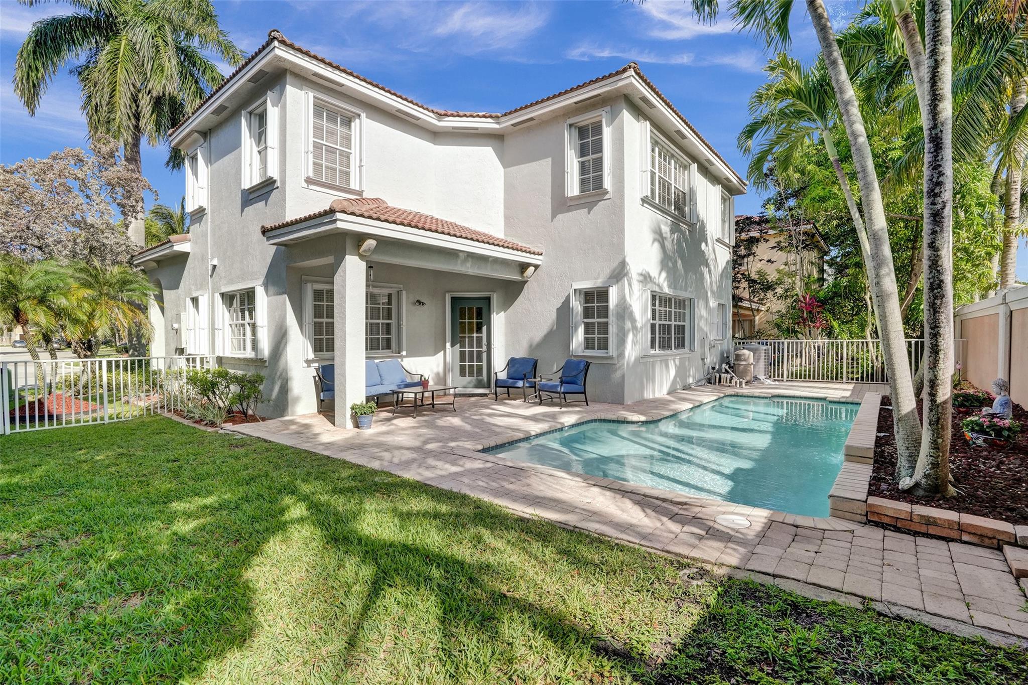 Beautiful 4 bedroom/2.5 bathroom POOL home that overlooks a canal from the 2nd floor. BRAND NEW LAMINATE FLOORS, UPDATED KITCHEN with BRAND NEW STAINLESS STEEL APPLIANCES, QUARTZ COUNTERTOP & white Wood Cabinets, FRESHLY PAINTED EXTERIOR, NEW AC with transferrable 10 year warranty, NEW WATER HEATER, NEW SMART SPRINKLER SYSTEM (1.5 years old) that runs on app/syncs with weather channel, NEW POOL PUMP & MOTOR, FRESHLY DIAMOND BRIGHTED POOL with waterfall features and removable baby fence, fully fenced backyard, covered pavered patio. Located in a GATED COMMUNITY with community pool, hot tub, gym and tennis courts. Low HOA includes Landscaping, Cable TV and alarm monitoring.
