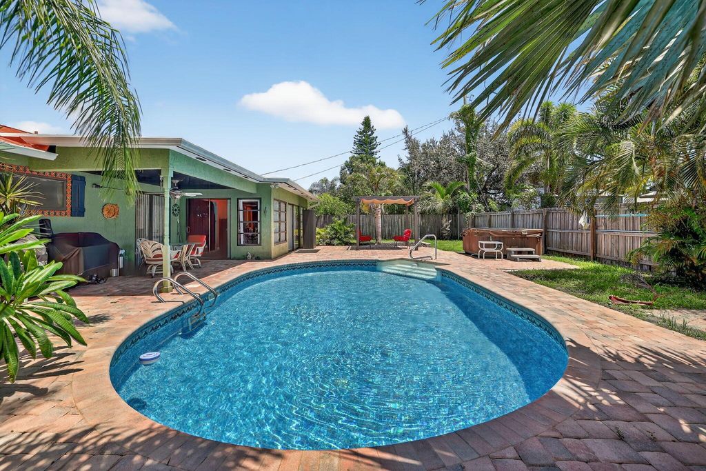 Photo of 401 NE Oleander Avenue, Port Saint Lucie, FL 34952 (MLS # R11110462)