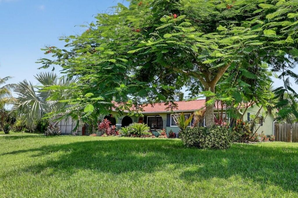 Photo of 401 NE Oleander Avenue, Port Saint Lucie, FL 34952 (MLS # R11110462)