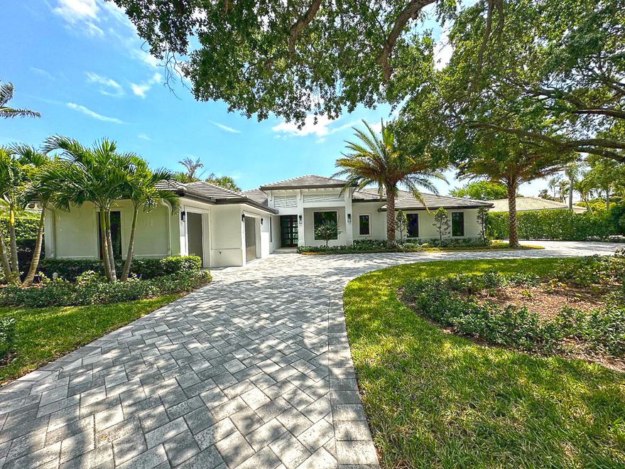 Contemporary Custom Waterfront Home in Prestigious Admirals Cove.   Sleek and Sophisticated in Design with custom finishes, open floor plan, 3 .1 garage, long water views, luxurious primary suite with large walk-in closets, 2 offices, and much much more.