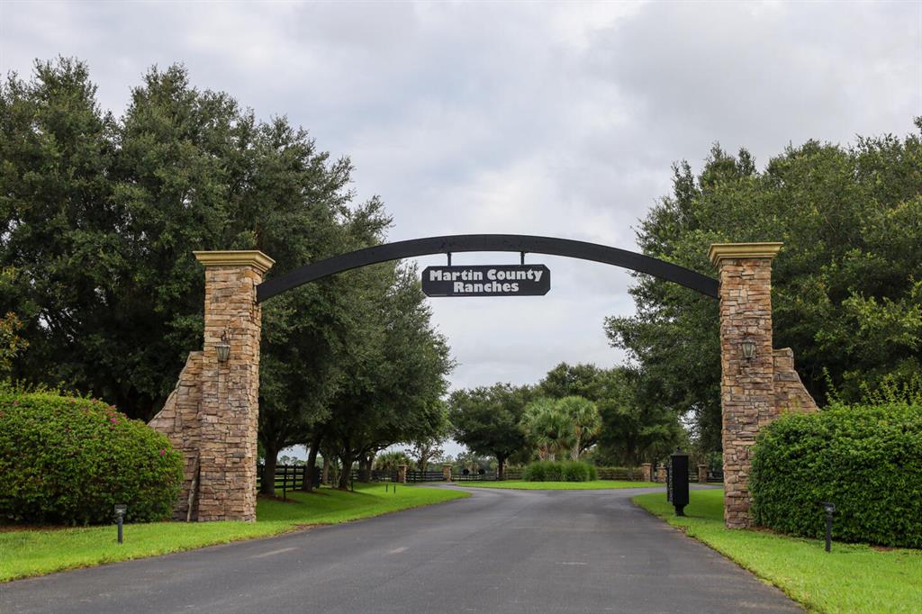 20 +Acre, No Wetland! Upscale property with 4 board fencing front and back and gate. This is in the Equestrian Martin County Ranch Community! Here you will find your own ''Olde Florida'' piece of paradise and rural freedom.Perfect for you to design your own custom estate, guest home, barn and have all your toys!Community has over 4.5 miles of Bridal Paths, paved roads, underground electric, fiber optics, and off one of the prettiest roads in South Florida called ''The Grade''. Martin Hwy is like a covered green archway and named as one of the best in the state. Call us for the HOA info, survey and utility info. Enjoy peace and quiet and Nature as it was meant to be. Good access to highway, airports and beaches. Currently has cattle on property for the AG exemption. Great get-away