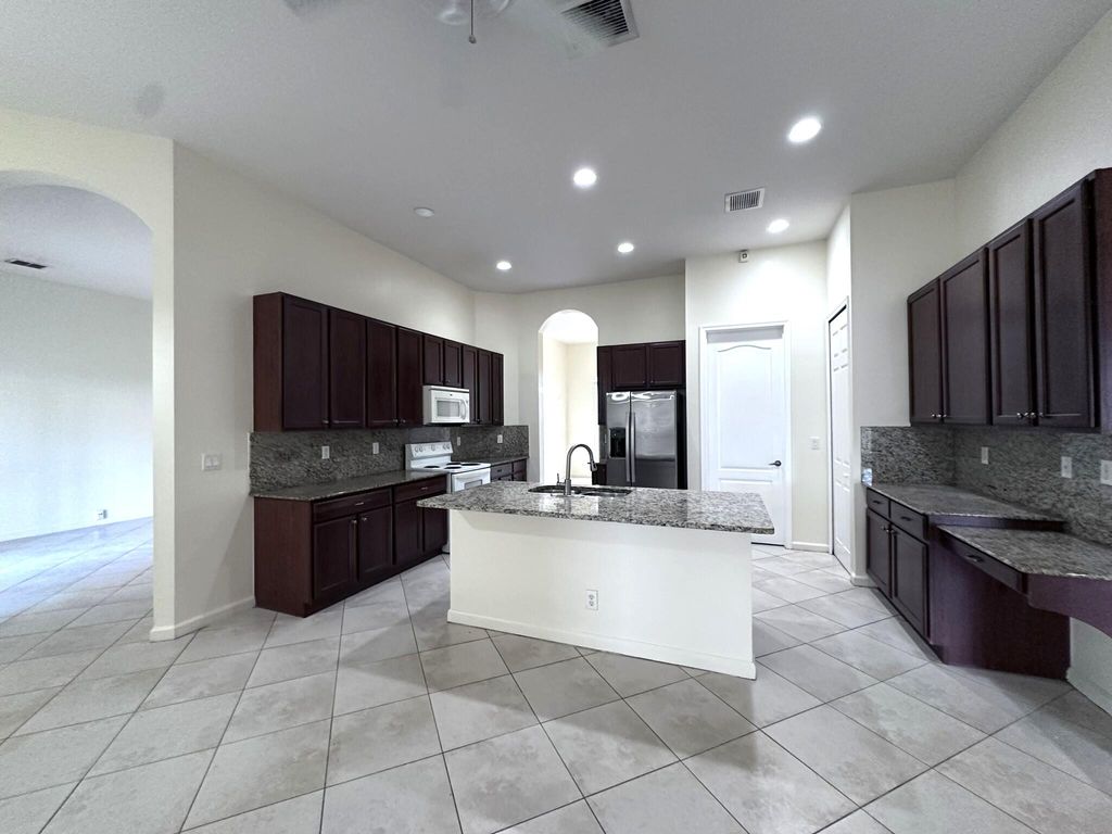 Photo of 6025 NW Wolverine Road, Port Saint Lucie, FL 34986 (MLS # B26014897)