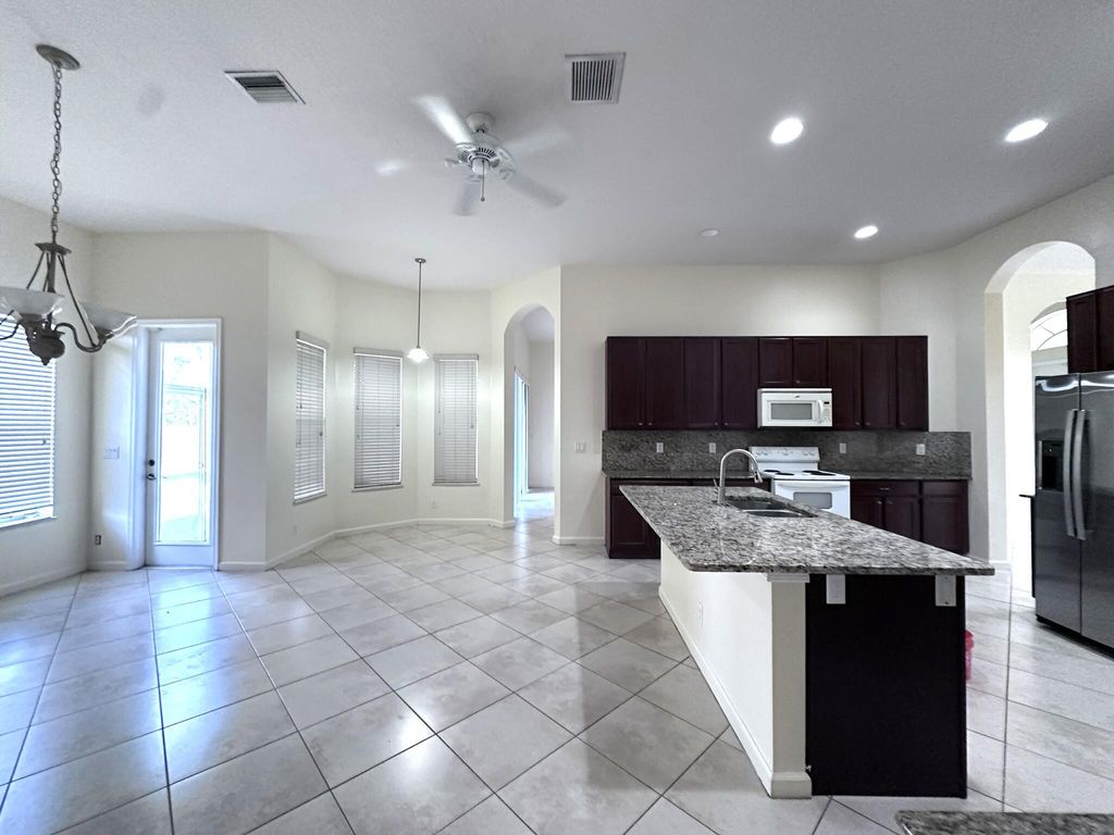 Photo of 6025 NW Wolverine Road, Port Saint Lucie, FL 34986 (MLS # B26014897)