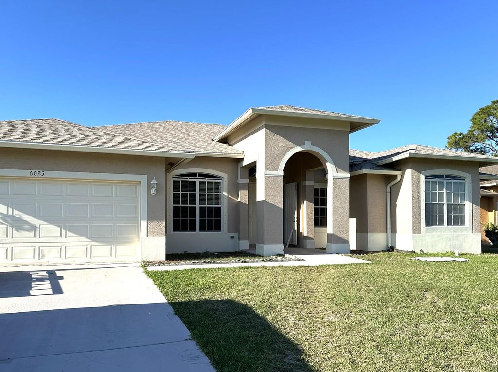 Photo of 6025 NW Wolverine Road, Port Saint Lucie, FL 34986 (MLS # B26014897)