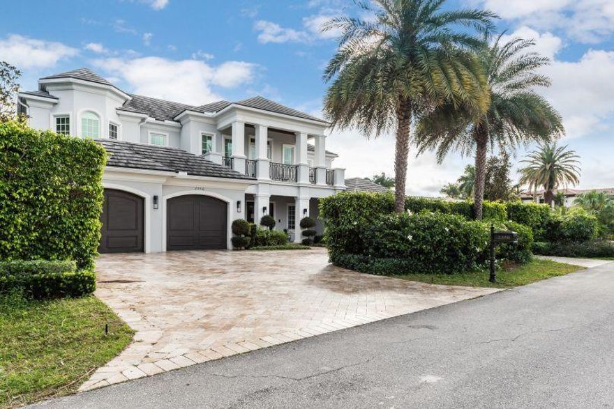 Absolutely stunning estate home situated on an oversized lot with east exposure in Royal Palm Yacht & Country Club! Step inside the foyer entry and enjoy spacious living areas with exquisite flooring throughout along with an elegant chef's kitchen. Enjoy the club room, and wine cellar which are downstairs then take the grand staircase or elevator to the second floor where you will see the expansive master suite with luxurious his and her bathrooms and ample closets. All of the bedrooms are spacious as well and there are multiple spacious terraces/balconies in this lovely property. Outside you will enjoy an enormous patio overlooking the serene pool.  This estate home has it all and offers true luxury living in this upscale Boca Raton Country Club.