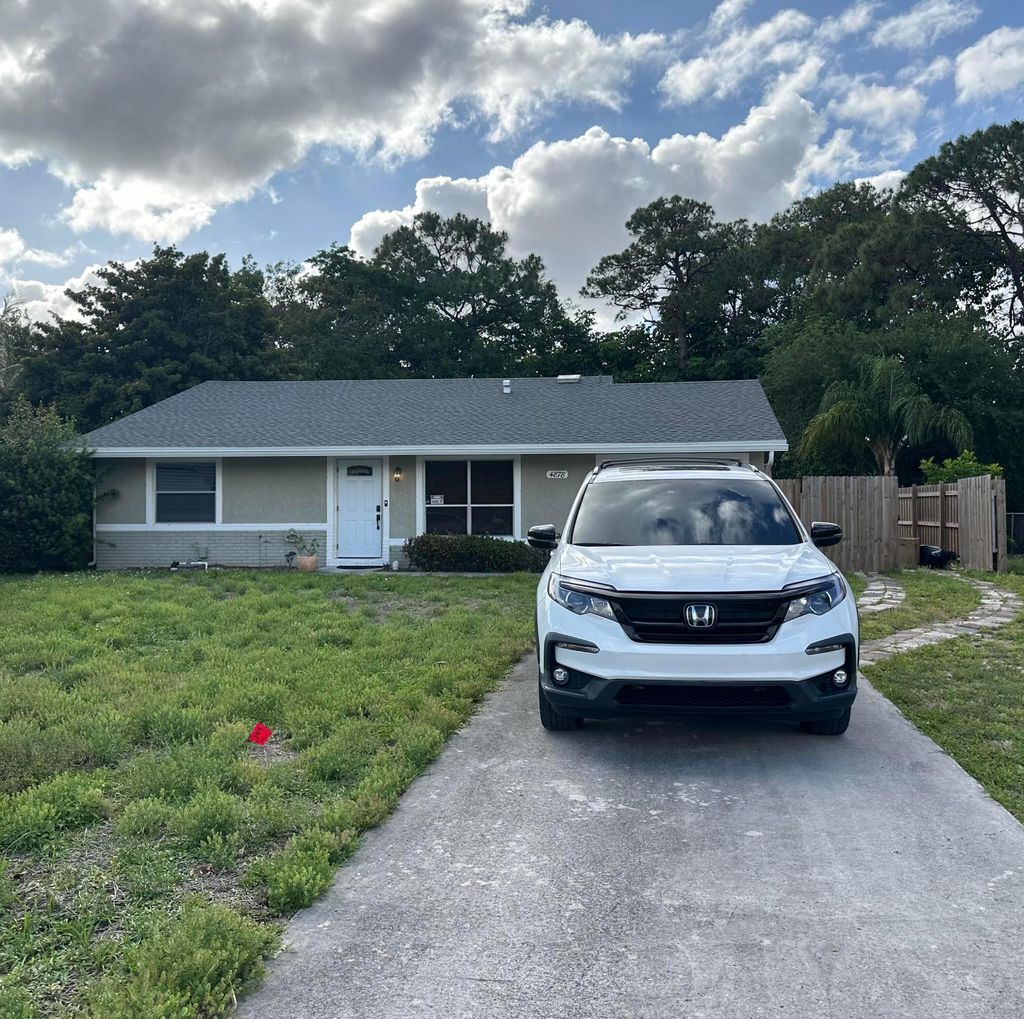 Photo of 4878 Spartacus Drive, Lake Worth, FL 33463 (MLS # B26015029)