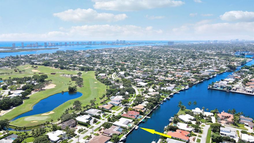 Welcome to one of the most coveted streets in all of North Palm Beach -- Country Club Drive. Situated on an expansive 13,000+ square foot lot in the prestigious Country Club Addition, this property offers over 100 feet of prime waterfront, providing direct Intracoastal access with no fixed bridges -- a true boater's dream. Just 10 minutes to the Palm Beach Inlet by boat, this location is ideal for those seeking an effortless South Florida lifestyle on the water. Whether you're an avid yachtsman or simply love the water, the possibilities here are unmatched. The existing 3,500 sq ft home offers a solid footprint for a substantial remodel, or presents a rare opportunity to build your custom waterfront estate from the ground up -- a rarity in such a sought-after neighborhood