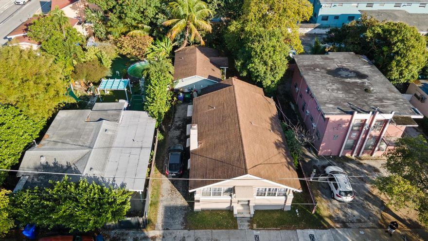 Income-producing duplex located in the heart of Miami. The property consists of a main residence with 3 bedrooms and 2 bathrooms, and a detached unit with 1 bedroom and 1 bathroom. Both units are tenant occupied on month-to-month leases. No HOA.

Property requires repairs and general TLC. Roof on the main house may need replacement. Buyer to verify condition, zoning, and use. Ideal opportunity for investors or owner-occupants.