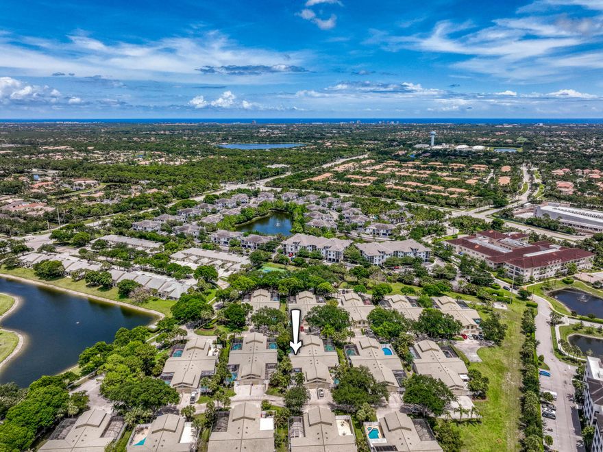 This beautifully updated 3 bedroom, 3.5 bath townhome with a 1 car garage is located in the sought-after Westwood Lakes community in the heart of Palm Beach Gardens. Live comfortably with ALL IMPACT GLASS windows and sliders. Soaring vaulted ceilings and dual skylights fill the home with natural light, enhancing the open floor plan. The first floor features wood-look porcelain tile flooring and a well-designed layout with the primary suite, one guest bedroom with ensuite bath and powder room on the first floor. The private guest bedroom upstairs also offers an ensuite bath. Whip up delicious meals in the kitchen with white shaker cabinetry, upgraded appliances, and gorgeous Callacutta solid surface countertops. The adjacent dining area includes a custom built-in bar with upper and lower cabinetry, highlighted by a skylight. The main living area showcases vaulted ceilings and impact sliding glass doors that seamlessly open to the outdoor space. The primary suite boasts a generously sized closet and direct patio access through the impact sliders. Pamper yourself in the primary bath with dual vanities with granite countertops, framed mirrors, and a large soaking tub/shower combo. The screen-enclosed outdoor living area is centered around a large spa, creating a private setting to enjoy the Florida lifestyle year-round. The HOA covers exterior maintenance including roof maintenance and replacement, landscaping, irrigation, driveways, and painting. Conveniently located near pristine beaches, I-95 and Florida's Turnpike, amazing restaurants, The Gardens Mall, Downtown at the Gardens, Alton Town Center, and so much more. Live your best life here!