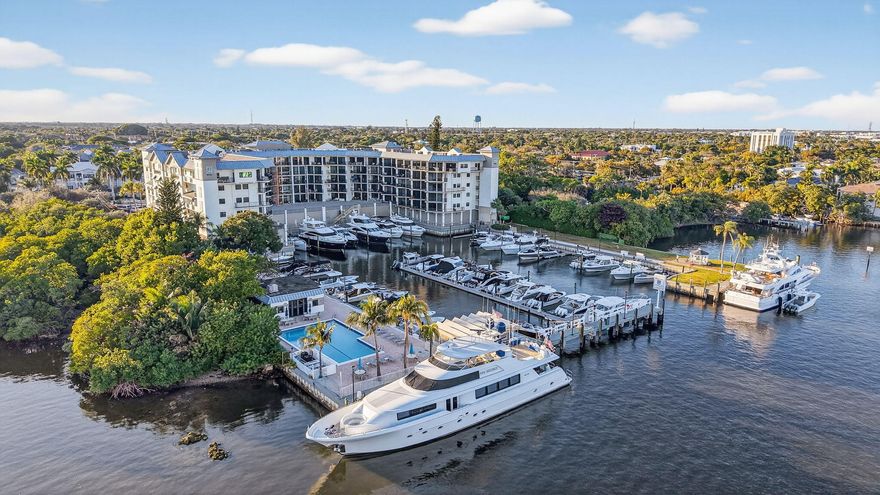 Exquisite 4th-floor, 2-story condo offering 2,145 sq. ft. of refined waterfront living with soaring windows capturing sweeping intracoastal and marina views. Stylishly remodeled throughout, the open kitchen features custom cabinetry and high-end appliances, flowing seamlessly into the living and dining areas with a thoughtfully designed wet bar and wine refrigeration, ideal for entertaining. A generously sized  balcony provides an inviting setting to relax and enjoy the water views. Upstairs features two well-appointed bedrooms, balcony, and beautifully renovated, spa-inspired bathrooms finished with premium materials and sophisticated design. Every detail reflects a curated palette of natural wood, metal, glass, and stone, blending function, art, and modern technology. Smart-home integration and eco-conscious, energy-efficient features enhance comfort and convenience. Delray Harbor Club residents have priority access to the deep-water marina boat slips, and features a pool, cabana, outdoor grills, gazebo, garage parking, additional resident and guest parking, lawn areas for pets and a gated setting with security. The building has completed an extensive series of upgrades, including concrete restoration and features impact windows throughout.   The marina offers electric and water hookups, as well as a on-site fueling station. Enjoy being steps from shops and dining, and minutes to Delray Beach, Atlantic Avenue, and pristine beaches.