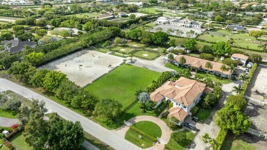 Location, Location, Location! Saddle Trail at its best. This 4.1 acre equestrian estate has direct bridle path access to the horse show. It has it all starting with an elegant 5 bedroom (all ensuite) home ready for you to move into. High ceilings, chefs kitchen, impact glass and three (3) different living areas for multi generational living. Expansive outdoor living area with a new pool perfect for entertaining or just relaxation. The 15 stall center aisle barn is complete with 5 wash/grooming stalls, 2 tack rooms, office, laundry, bath, feed & hay storage, fly spray system, roll down doors & shutters.. There is a 150' X 210' arena with GGT footing, 115' X 140' grass jump field, 6 horse Kraft walker and 7 large paddocks. There is a 1 bedroom barn apartment with patio and a 2 bedroom and 1 bath apartment with private laundry.

There is a separate storage 2-bay building for your jumps, tractor, drag and golf carts. Easy access throughout the property for trucks, trailers and many vehicles.

This is truly an equestrian family retreat and only a short hack to the show grounds! A MUST SEE PROPERTY!