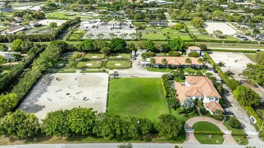 Location, Location, Location! Saddle Trail at its best. This 4.1 acre equestrian estate has direct bridle path access to the horse show. It has it all starting with an elegant 5 bedroom (all ensuite) home ready for you to move into. High ceilings, chefs kitchen, impact glass and three (3) different living areas for multi generational living. Expansive outdoor living area with a new pool perfect for entertaining or just relaxation. The 15 stall center aisle barn is complete with 5 wash/grooming stalls, 2 tack rooms, office, laundry, bath, feed & hay storage, fly spray system, roll down doors & shutters.. There is a 150' X 210' arena with GGT footing, 115' X 140' grass jump field, 6 horse Kraft walker and 7 large paddocks. There is a 1 bedroom barn apartment with patio and a 2 bedroom and