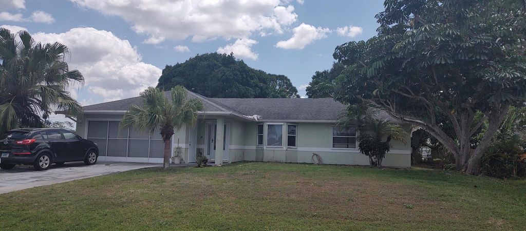 Photo of 506 SW Butler Avenue, Port Saint Lucie, FL 34983 (MLS # R11081947)