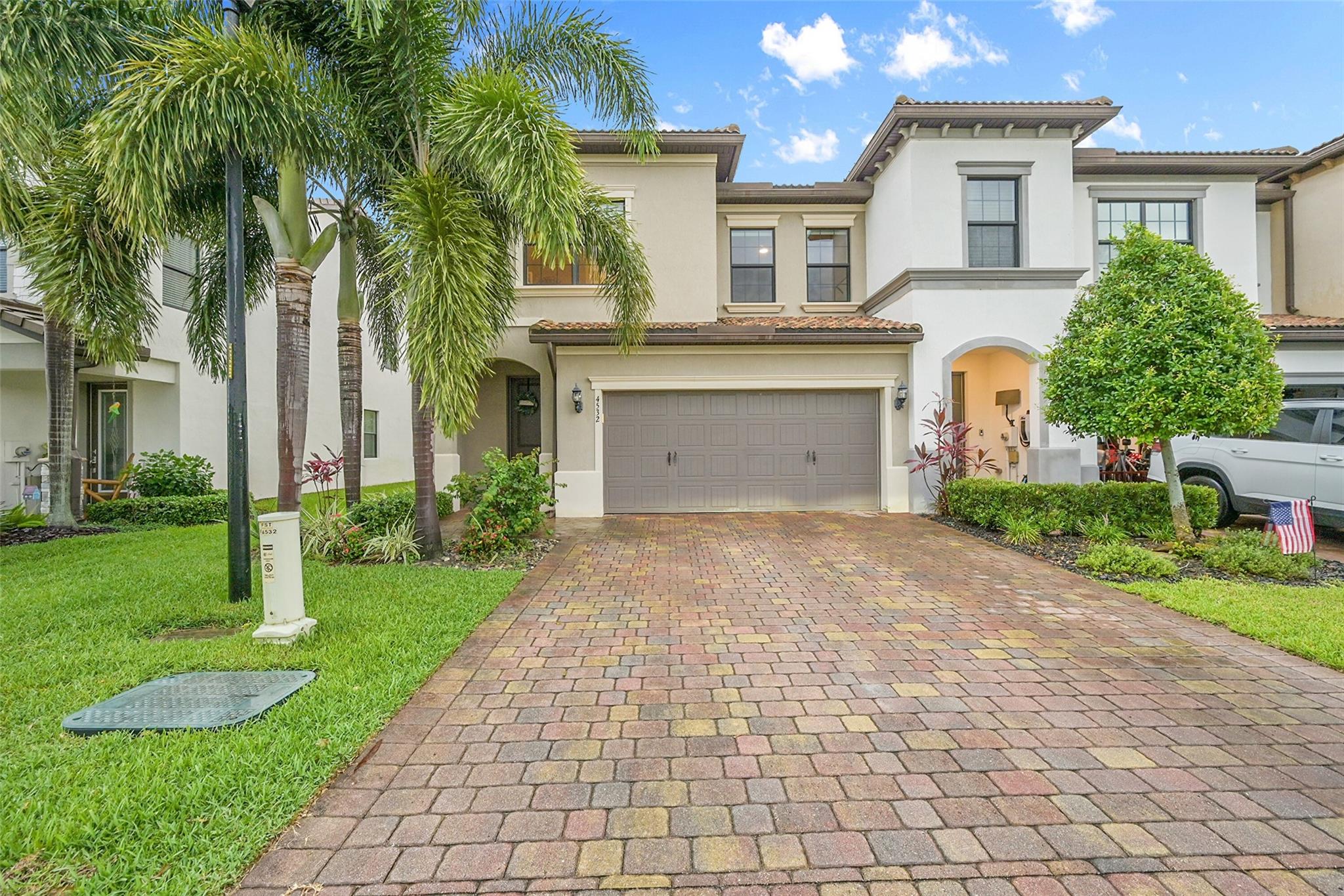 Immaculate End-Unit 3/2.5/2car Townhome, built 2018 in ALL AGES, gated community of The Fields. Walk into your Open Concept Floor Plan. All finishes and fixtures tastefully selected by Interior Designer. Upgraded dropped ceiling tray in master bedroom. All bedrooms have Walk-in Closets, Frameless shower door & floor to ceiling tile in master shower, Dual vanity in both upstairs bathrooms, No carpeting in home. Vinyl Plank flooring throughout . Upgraded dining room extension, Huge kitchen island (quartz), Upgraded kitchen SS Appliances, Stack W/D , 2- Resort like community pools, workout facility, A- rated schools just a few blocks away, close to Turnpike and beaches just 25 mins away. large private backyard, and side yard. available late August.