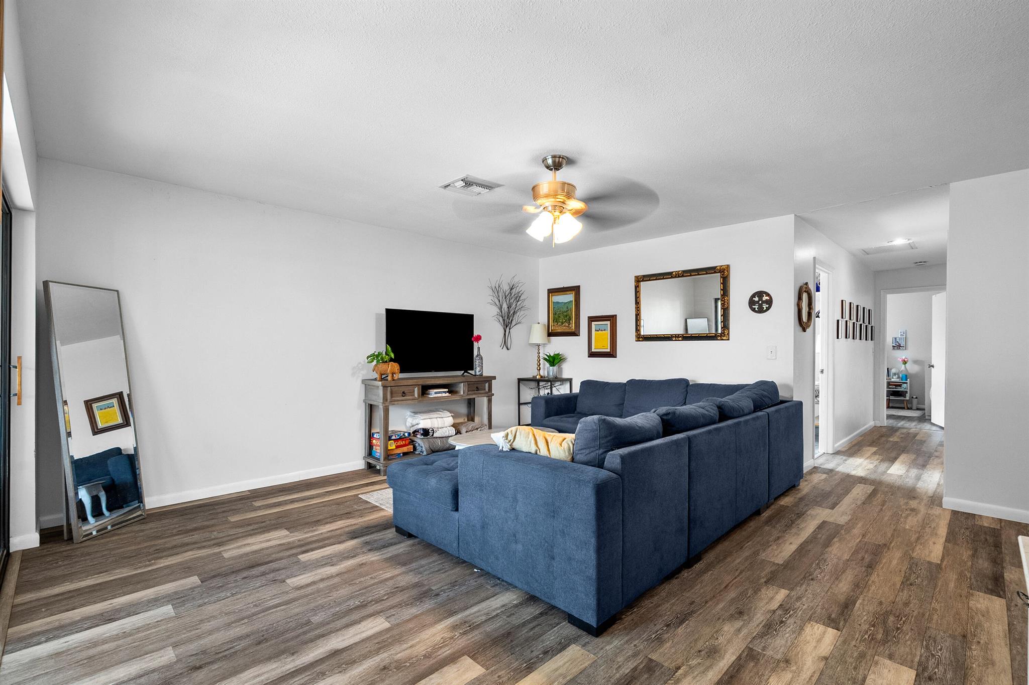 Freshly updated and move-in ready, this spacious 3-bedroom, 2-bath corner-unit condo offers bright, open living in the heart of Stuart. The large primary suite, upgraded bathrooms, and new hardwood-style flooring throughout bring a comfortable, modern feel. The kitchen features wood soft-close cabinetry, granite countertops, and quality finishes. A standout feature is the large front patio enclosed with impact windows, creating a flexible space you can enjoy year-round. Light and airy thanks to its corner location, this home is just minutes to shopping, top-rated schools, beaches, and all the lifestyle amenities Stuart is known for. A newer A/C (2021) adds peace of mind, and the well-maintained community offers a pool, tennis courts, and sidewalks perfect for enjoying the neighborhood.