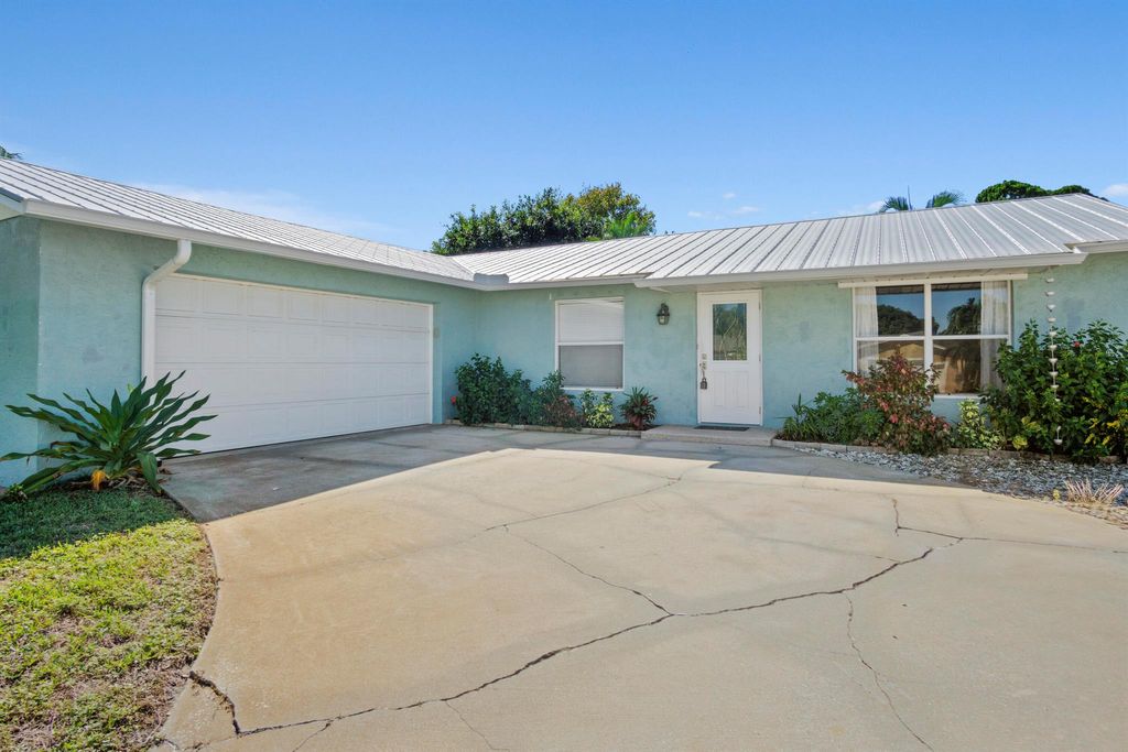 Photo of 9032 SE Sandridge Avenue, Hobe Sound, FL 33455 (MLS # R11137236)