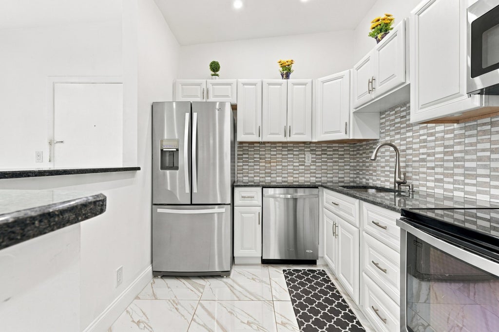 Photo of 15488 Lakes Of Delray Boulevard, Delray Beach, FL 33484 (MLS # B26095013)