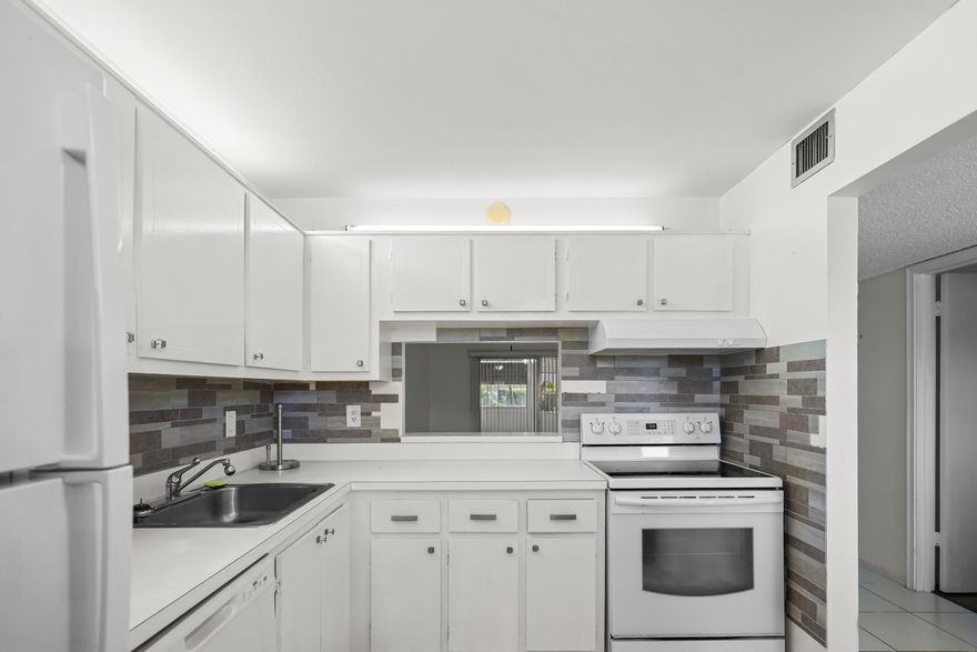 Prime Delray Beach location at 2500 Fiore Way #103A. This first-floor condo puts you just minutes from Atlantic Avenue's renowned dining, shopping, and nightlife, with quick access to I-95, Delray's beaches, and area golf. Commuters and weekenders alike will appreciate how easy it is to get anywhere you need to be. The unit offers a practical layout with an open porch overlooking a peaceful lake view — a nice spot to enjoy your morning coffee. Ground-floor access means no stairs or elevators to deal with. Community amenities include a pool, tennis courts, fitness center, and an on-site library, all set within a well-kept, quiet neighborhood. Available for sale or lease — a solid opportunity for buyers, investors, or tenants who want location, lifestyle, and value of South Florida.