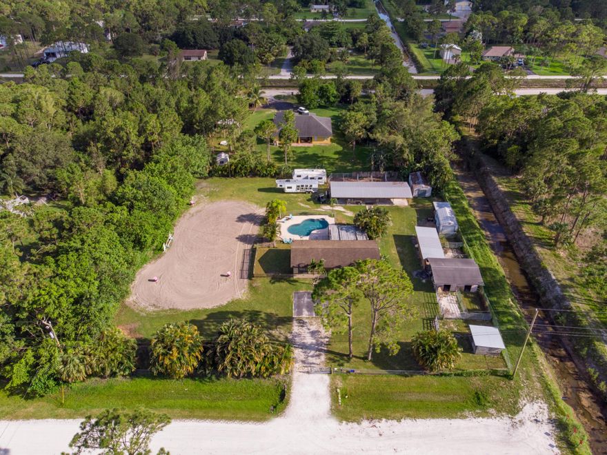 This gorgeous equestrian home boasts your own private heaven, from the comforts of your home to a relaxing built in pool to the 190 x 80 lighted sand arena with beautiful barns that boasts Armour gate doors and stainless steel dividers and filtered running water throughout both barns. Bring your family and your horses and dont miss out on owning your dream home.