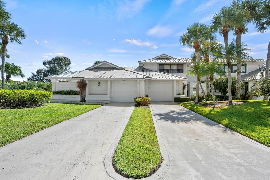 Spacious lakefront golf villa with 3 bedrooms, 2.5 bathrooms, office, 1 car garage, and outside courtyard. Numerous upgrades include a wine bar, new AC, new dishwasher, newer hot water heater, range, microwave, washer and dryer, quartz countertops in kitchen and bath. Remodeled powder room, new tile in FL/office room, Generous storage. Complete hurricane. Townhouse style unit offers plenty of privacy all within the award winning resort style guard gated Mariner Sands Country Club. This low maintenance unit makes this the perfect lock and go home or enjoy paradise all year long! Residents enjoy 24-hr professionally manned gate and patrol and full Clubhouse, Sand Bar Cafe', Pool, Tennis, Pickleball, Fitness Center/Spa, Croquet and Bocce privileges.