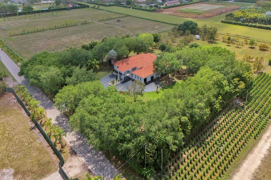 Extraordinary Upgraded Estate on 5 Acres with over 6,000 square feet under air. An Aviators Paradise! Welcome to your dream retreat — a one-of-a-kind estate designed for those who live life at full altitude. Set on expansive acreage, this remarkable property features a private, fully operational landing strip, offering direct access for small aircraft and the ultimate convenience for adventurers, pilots and remote workers alike. The residence itself is a stunning blend of comfort and sophistication. The land is well-suited for a variety of agricultural pursuits — from hobby farming to full-scale operations — with plenty of space for crops, livestock, or orchards. The main residence is warm and inviting, with modern comforts and stunning views across open fields and endless skies.