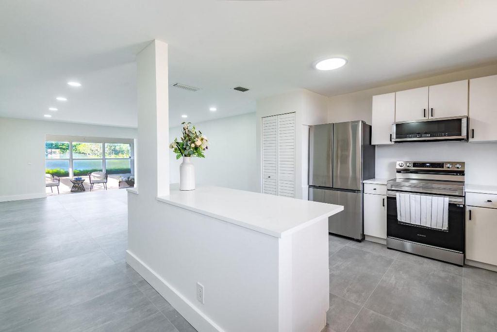 Photo of 604 Laconia Circle, Lake Worth, FL 33467 (MLS # R11157875)