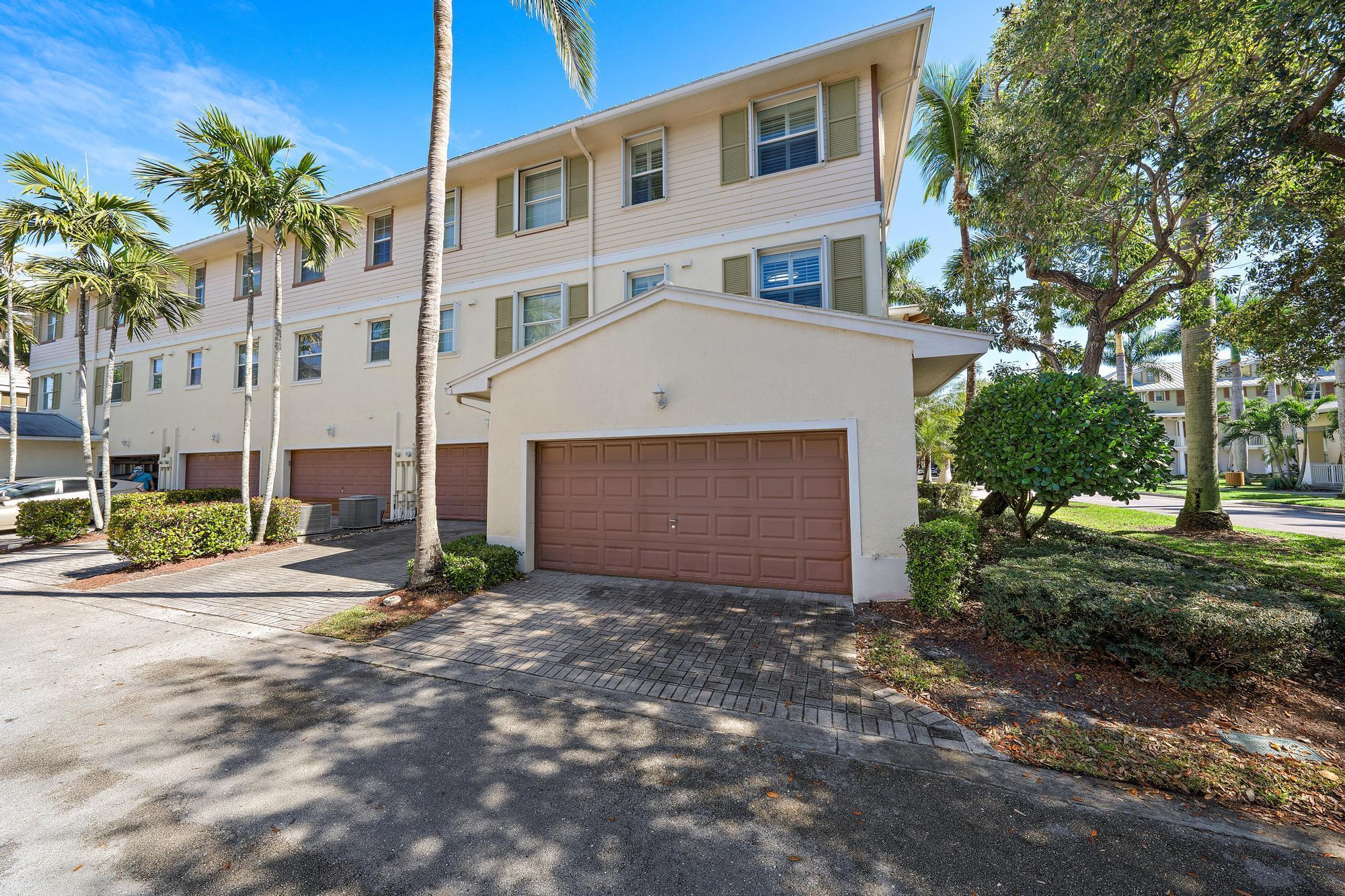 VERY RARE live/work corner unit home available in the heart of Jupiter and Abacoa. This amazing home is one of few in the community that allows you to run a business on the first floor which has a separate entrance and restroom. There is plenty of space to run any business out of and this space can also be separated with a wall from the main entry which would allow someone to lease out the bottom floor to a business and have complete privacy. This area also has plenty of other uses such as a third bedroom, playroom room, billiards room, theater room, truly anything. Walking up the stairs to the second and main floor you will be greeted by the open kitchen featuring stainless steel and never used appliances, granite countertops, and a pass through to the dining room.