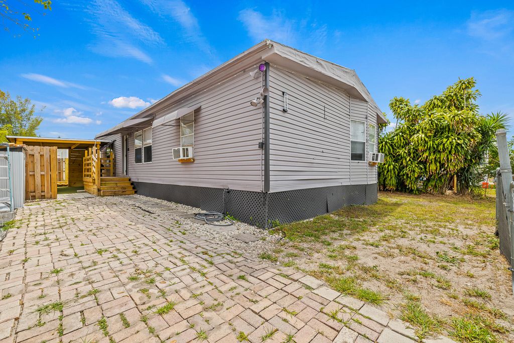 Photo of 10592 SW Sandalfoot Boulevard, Boca Raton, FL 33428 (MLS # R11129804)